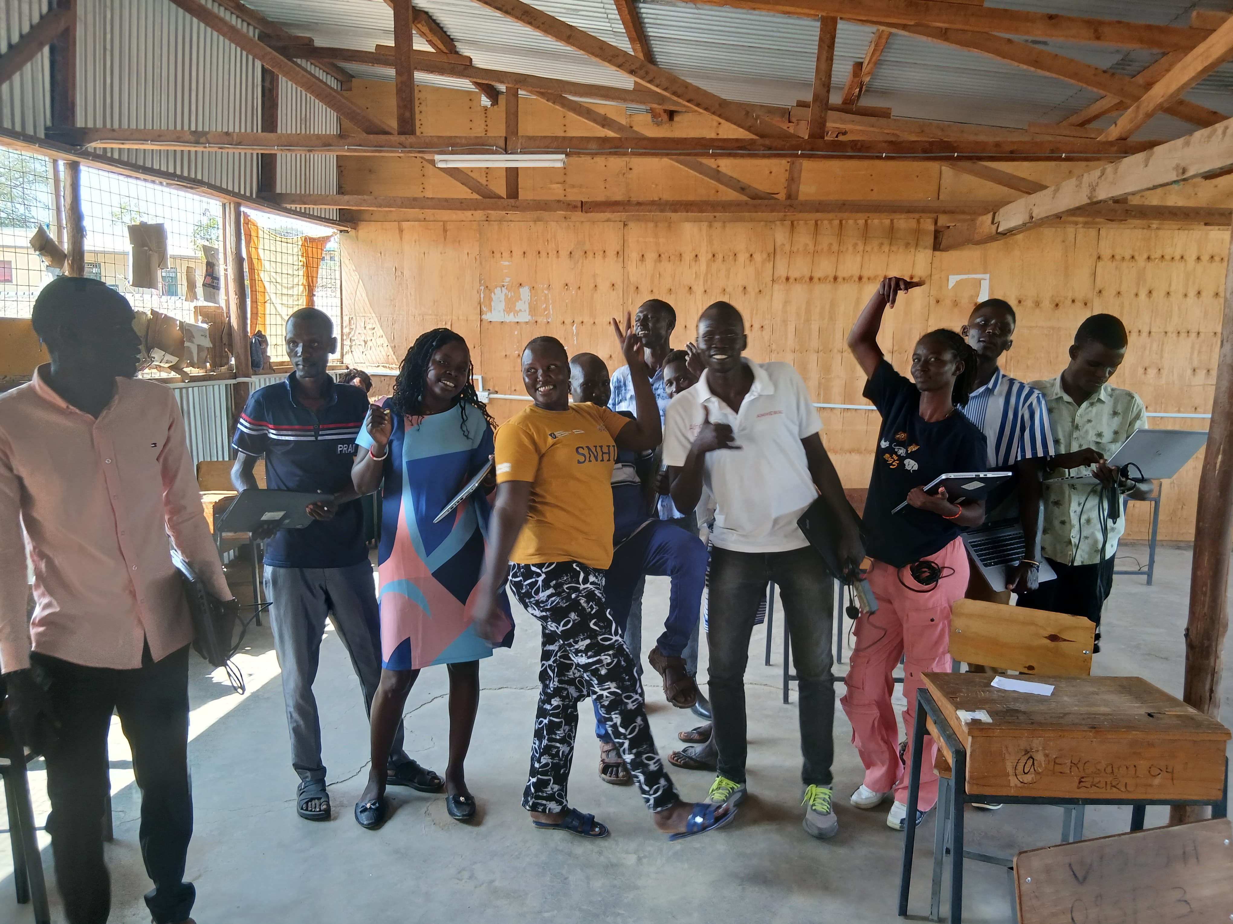 ICT training group photo with laptop distribution